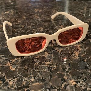 Rectangle cream rectangle sunglasses with orange lenses